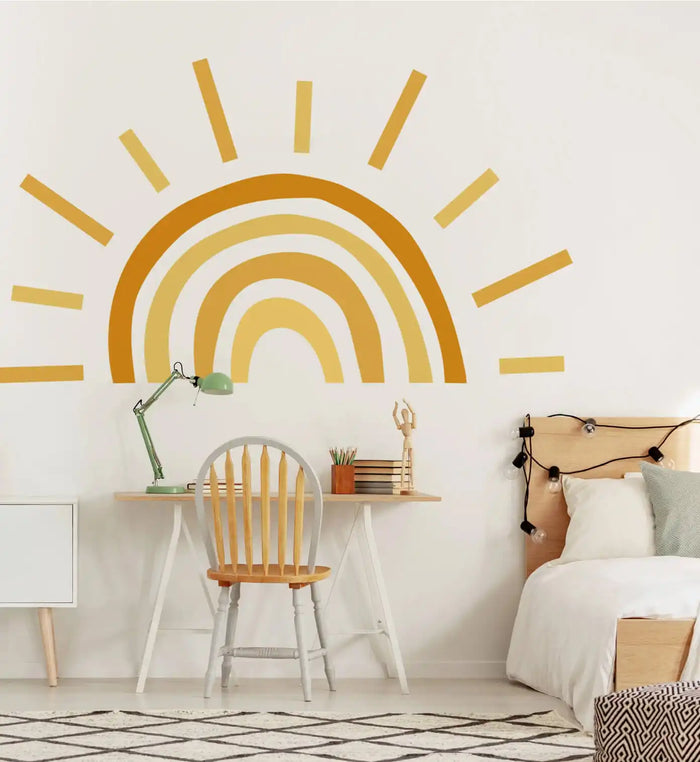 Golden rainbow wall decal with radiating sunburst lines.